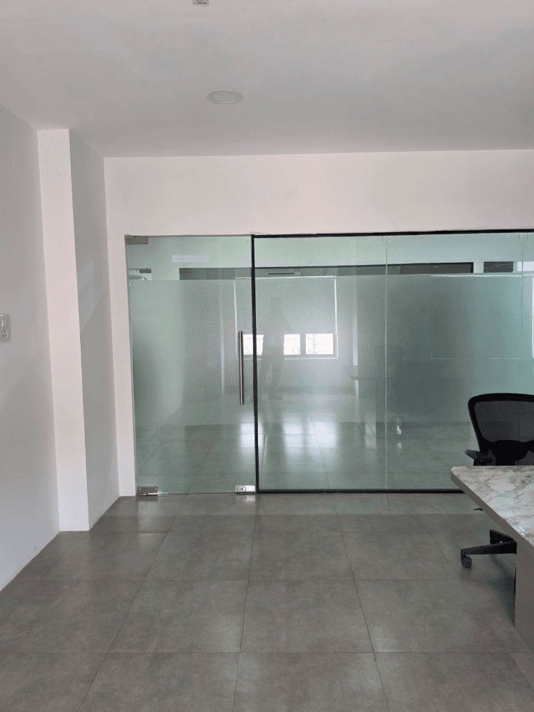 Frosted glass partition and door leading into a cabin
